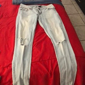 Low cut ripped light blue jeans